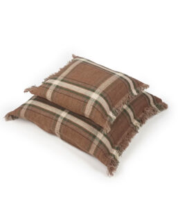 Two brown plaid decorative pillows with fringe edges stacked on a white background.