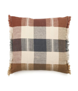 Square plaid pillow in brown, beige, and navy tones with fringed edges.
